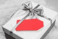 Blank red tag on a white gift box. Christmas gifts Royalty Free Stock Photo