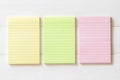 Blank reminder paper pad with horizontal line stripes on white wood