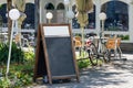 Blank restaurant shop sign or menu boards near the entrance to restaurant. Cafe menu on the street. Blackboard sign mockup in Royalty Free Stock Photo