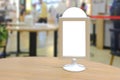 Blank retail POS point-of-sale display in restaurant for advertising mockup purpose, selective focus. For comping in of menu Royalty Free Stock Photo