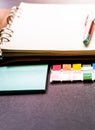 Blank ring binder planner with colorful index tabs and blue note pads use for time management Royalty Free Stock Photo