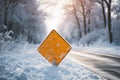 A blank road traffic sign warning of winter driving conditions on a road Royalty Free Stock Photo