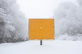 A blank road traffic sign warning of winter driving conditions on a road Royalty Free Stock Photo