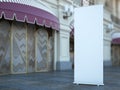 Blank roll up banner near old building. 3d rendering