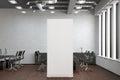 Blank roll up banner stand in white brick office interior. Royalty Free Stock Photo