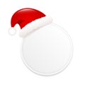 Blank round gift tag with cap of santa claus isolated on white background