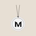 Blank round tag with M initial for Merry Royalty Free Stock Photo