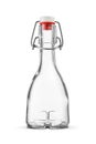 Blank rounded empty clear bottle with vintage swing top isolated on white Royalty Free Stock Photo