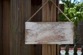 Blank rustic sign hanging from wooden fence Royalty Free Stock Photo