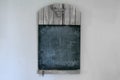 Blank rustic wooden chalkboard hanging on a wall Royalty Free Stock Photo