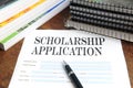 Blank scholarship application on desktop Royalty Free Stock Photo