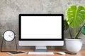 Blank screen of All in one computer, keyboard, mouse,  tablet, smart phone, monstera plant pot and clock Royalty Free Stock Photo