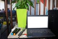 Blank screen laptop computer on the Abstract blurred photo of conference hall or seminar room with attendee background Royalty Free Stock Photo