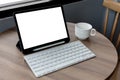 Blank screen laptop computer modern man use room laptop with blank white desktop screen with coffee cup on wooden table in cafe