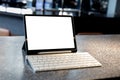 Blank screen laptop computer modern man use room laptop with blank white desktop screen with coffee cup on wooden table in cafe