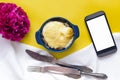 Blank screen mobile phone and buckwheat porridge with cheese and egg. Royalty Free Stock Photo