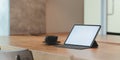 Blank screen tablet and a cup of coffee in comfortable workplace Royalty Free Stock Photo