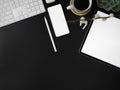 Blank screen tablet, smartphone, other digital devices, decoration and copy space on dark modern office desk Royalty Free Stock Photo