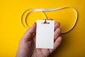 Blank security tags on yellow lanyards, mock-up