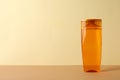 Blank shampoo bottle on beige background space for text Royalty Free Stock Photo