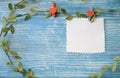 Blank sheet hanging on a clothespin on a turquoise wooden background Royalty Free Stock Photo