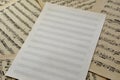 A blank of sheet music on a background of old vintage notes Royalty Free Stock Photo
