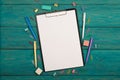 Blank sheet of paper and colorful office accessories Royalty Free Stock Photo