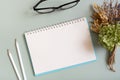 Blank sheet paper notebook on colored background top view. Flat lay Royalty Free Stock Photo