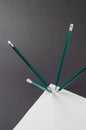Blank sheet of paper and standing pencils on a gray background Royalty Free Stock Photo