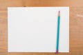 A blank sheet with a pencil on a wooden background. life with a clean slate Royalty Free Stock Photo