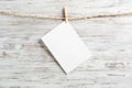 Blank sheet of white paper hanging on twine rope Royalty Free Stock Photo