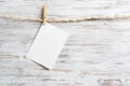 Blank sheet of white paper hanging on twine rope Royalty Free Stock Photo