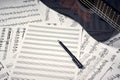 Blank sheets for notes, pen and guitar Royalty Free Stock Photo