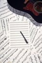 Blank sheets for notes, pen and guitar Royalty Free Stock Photo