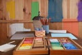 Blank sheets of paper, colorful chalk pastels and drawing pencils on wooden table indoors. Modern artist`s workplace Royalty Free Stock Photo