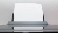 Blank sheets of paper coming out of an computer printer. Royalty Free Stock Photo