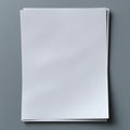 Blank Sheets of Paper Stacked on a Gray Background Inviting Creative Ideas and Artistic Expression in Design and Writing Royalty Free Stock Photo