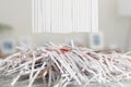 Blank Shredded paper above Cut up credit cards with Shredded Bills and Bank Statements Royalty Free Stock Photo