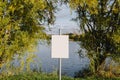 Blank sign on the lake. Empty space for text, copy space.