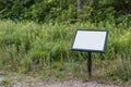 Blank sign in park during summer