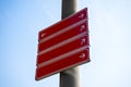 Blank sign post against blue sky