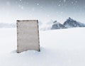 Blank sign in snow landscape during freezing winter