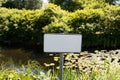 Blank signboard outdoors. Small forest fishing pond. Dangerous river swimming accident. Closeup white metal sign at Royalty Free Stock Photo