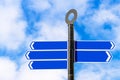 Blank signpost against blue sky Royalty Free Stock Photo
