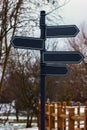 Blank signposts in a public park during winter