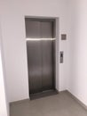 Blank Silver Lift in home Interior. Side View. Empty Lift with buttons close to it. Elevator Interior Royalty Free Stock Photo