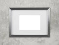 Blank silver picture frame on the wall