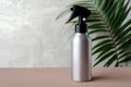 Blank silver trigger hair spray bottle. Natural organic cosmetic for hair salon concept Royalty Free Stock Photo