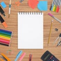 Blank Sketch book and school colorful tools on wood background Royalty Free Stock Photo