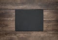 Blank slate board on wooden background Royalty Free Stock Photo